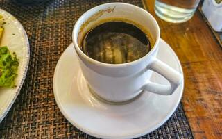 taza de americano negro café en restaurante café en México. foto