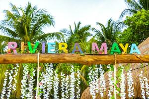 Playa del Carmen Quintana Roo Mexico 2023 Colorful Riviera Maya swing lettering sign symbol on beach Mexico. photo