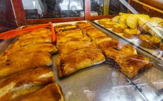 Bread rolls baguettes cakes and other pastries in Mexico. photo