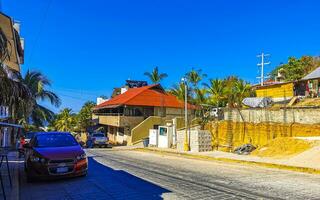 Puerto Escondido Oaxaca Mexico 2023 Typical beautiful colorful tourist street sidewalk city Puerto Escondido Mexico. photo