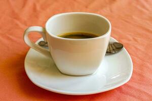 Cup with black coffee in resort Rasdhoo Atoll island Maldives. photo