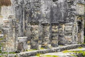 Ancient Tulum ruins Mayan site temple pyramids artifacts landscape Mexico. photo