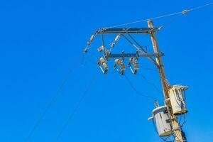 Absolute cable chaos on mexican power pole in Mexico. photo