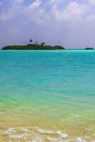 Rasdhoo island view from tropical sandbank islands Madivaru Finolhu Maldives. photo