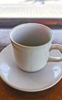 Cup of americano black coffee in restaurant Mexico. photo