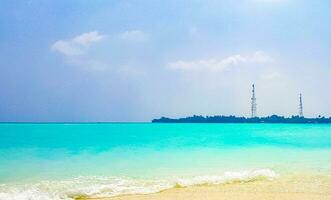 Rasdhoo island view from tropical sandbank islands Madivaru Finolhu Maldives. photo