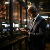 Businessman checking stock market on phone photo