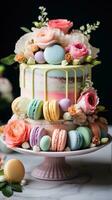 pastel arco iris pastel con macarons y flores foto