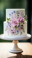 Simple white cake with watercolor florals photo