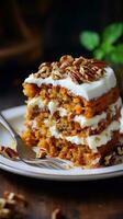 Moist carrot cake with cream cheese frosting and chopped pecans photo