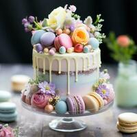 pastel arco iris pastel con macarons y flores foto