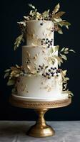 Elegant white cake with gold leaf and berries photo