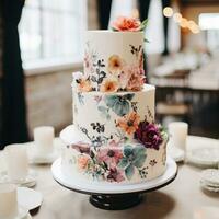 Simple white cake with watercolor florals photo