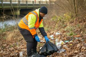 a man is cleaning up rubbish photo