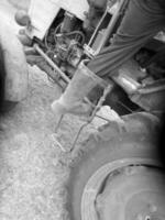 Plowed field by tractor in black soil on open countryside nature photo