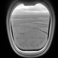 Beautiful view from airplane window, large wing of aircraft shows casement photo