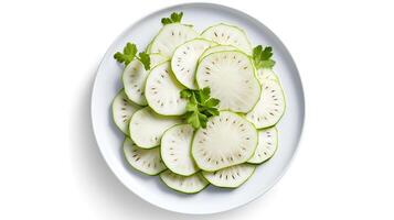 Photo of Kohlrabi slices on a plate isolated on white background.