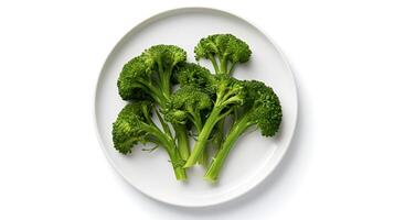 Photo of Broccolini on plate isolated on white background. Generative AI