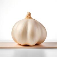 Photo of Garlic on wooden board isolated on white background.