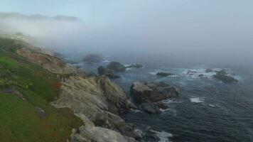 Misty Coastline of Carmel By The Sea and Big Sur - a Rugged Stretch of California Central Coast known for Winding Roads and Seaside Cliffs video