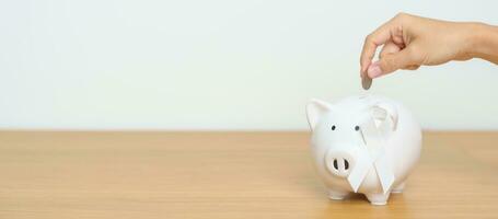 November Lung Cancer Awareness month, White Ribbon with Piggy Bank for support illness life. Health, Donation, Charity, Campaign, Money Saving, Fund and World cancer day concept photo