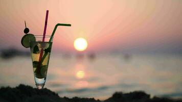 Mojito on the beach at sunset video