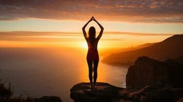 Woman stretching with sunrise in the background photo