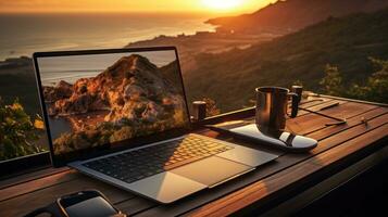 Man typing on computer at sunrise photo