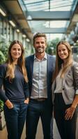 Happy team standing together in modern office photo