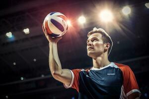 Male volleyball players are competing on the indoor volleyball court photo