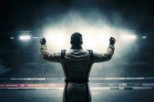 Race car driver express their joy at winning the race by raising their fists in the air photo