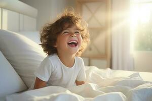 A boy happily wakes up in white bedroom photo