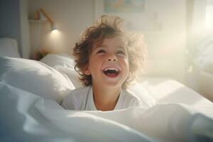A boy happily wakes up in white bedroom photo