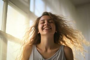 Woman happily wakes up in white bedroom photo