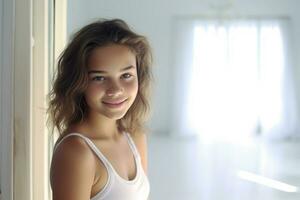 smiling girl with the mirror in the bedroom white photo