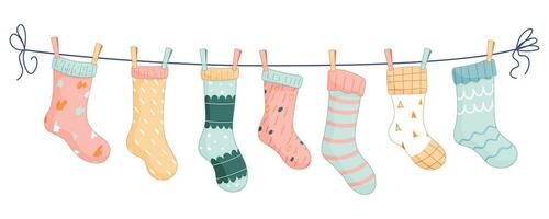 7 Baby socks with patterns on a rope with colored clothespins. Vector illustration