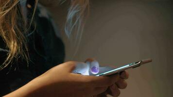 Woman typing message on cell when walking in the hallway of hotel video