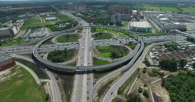 Flying over busy interchange with circular transport traffic in Moscow, Russia video