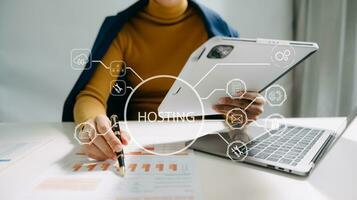Web hosting concept, woman using computer, tablet and presses his finger on the virtual screen inscription Hosting on desk, Internet, business, digital technology concept. photo
