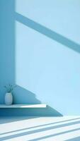 Minimal abstract light blue background for product presentation. Shadow and light from windows on plaster wall photo