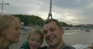 Excited family taking selfie video during traveling in Paris