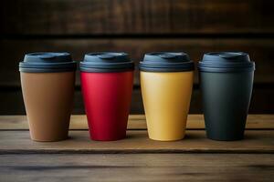 Reusable coffee cups on a rustic wooden table background with empty space for text photo