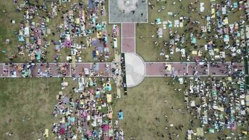 An aerial footage of Muslim congregation praying Eid in the field video