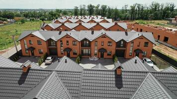 Aerial view of small town houses on road at landscape from above on residential area. 4k stock footage. video