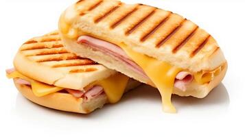 Cut cheese and ham toasted panini melt with grill marks. Isolated on white. . photo