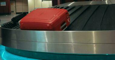 Suitcases on conveyor belt waiting for owners video