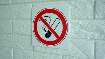 No smoking sign. No smoking sign hangs on a wall. 4k stock footage. video