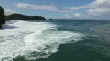 Aerial drone view of waves at the beach in Yogyakarta Indonesia video