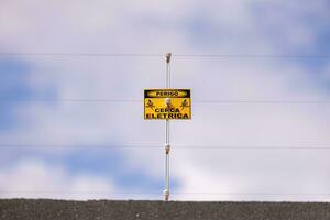 electric fence danger sign photo