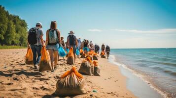 Beach cleanup. Volunteers collect trash on a sandy shore photo